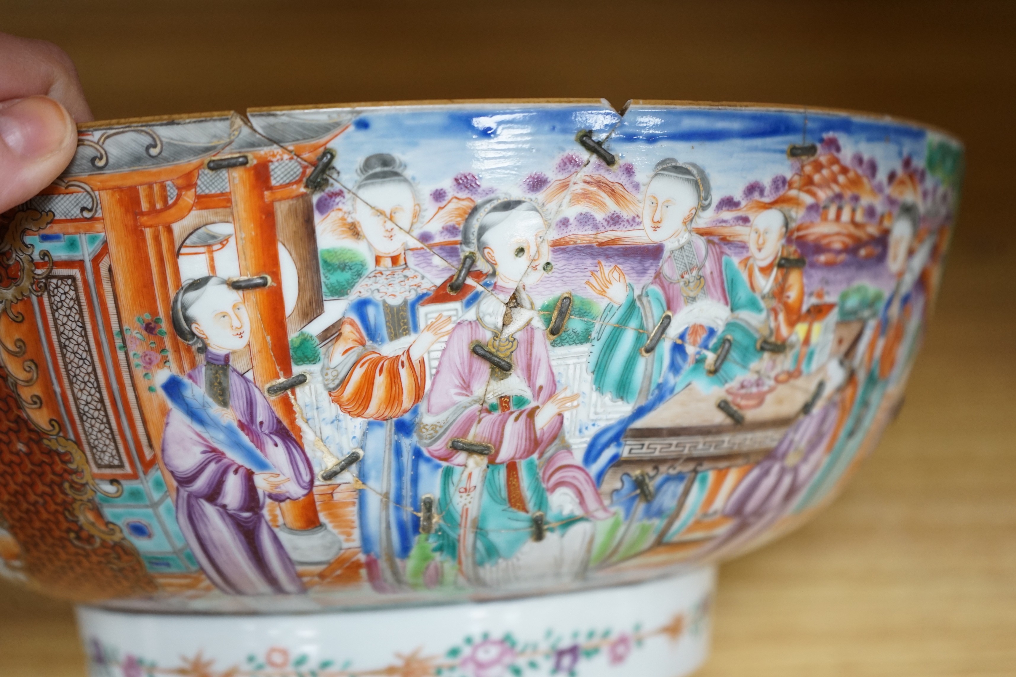 An 18th century Chinese export famille rose ‘mandarin’ punch bowl, 31cm diameter (af)